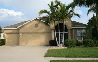 modern home with tropical landscaping