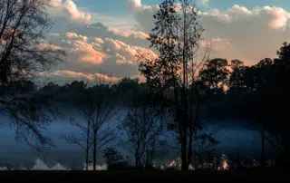 Sunset over a Misty Lake
