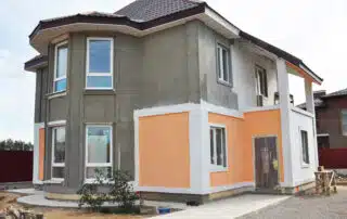 House renovation and repair with new stucco, plastering and pain