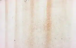 Stucco leak detection company inspecting EIFS and stucco siding for moisture intrusion, water damage, and exterior wall issues in residential properties